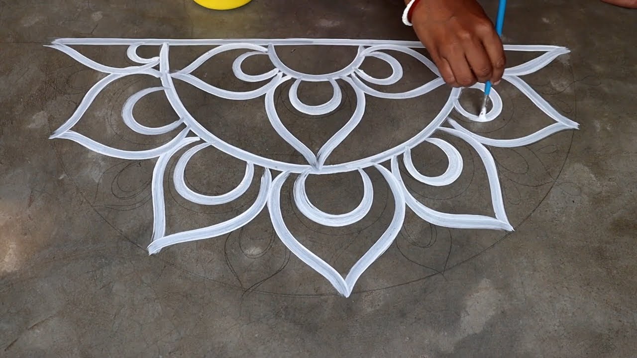 alpona design for saraswati puja